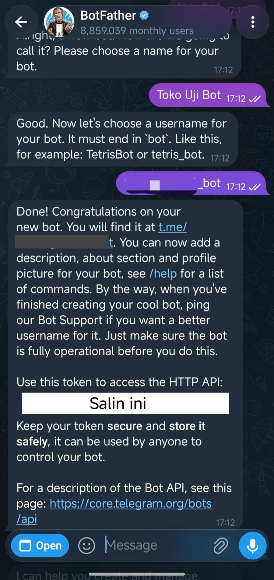 Balasan terakhir BotFather yang memuat token bot, dengan tokennya ditutup agar tidak terbaca